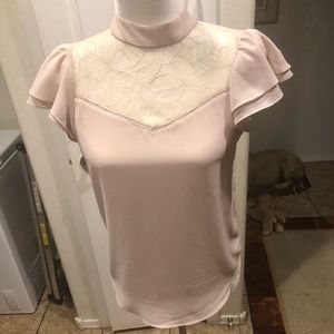 Cream colored woman’a shirt